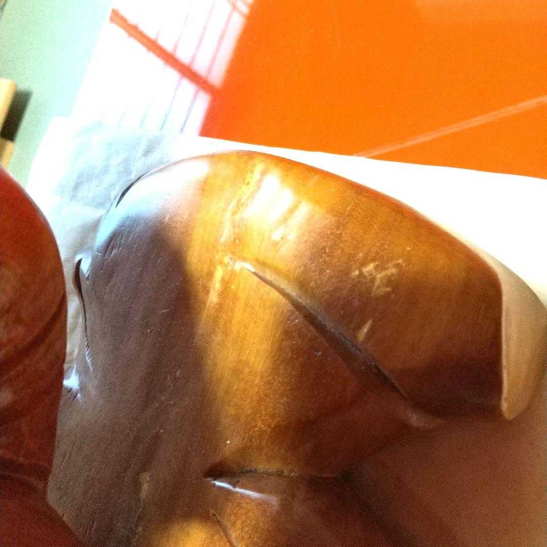 木製布袋の置物で一枚木彫りの高さ25cm長さ52cm幅15cm重さは約５キロです